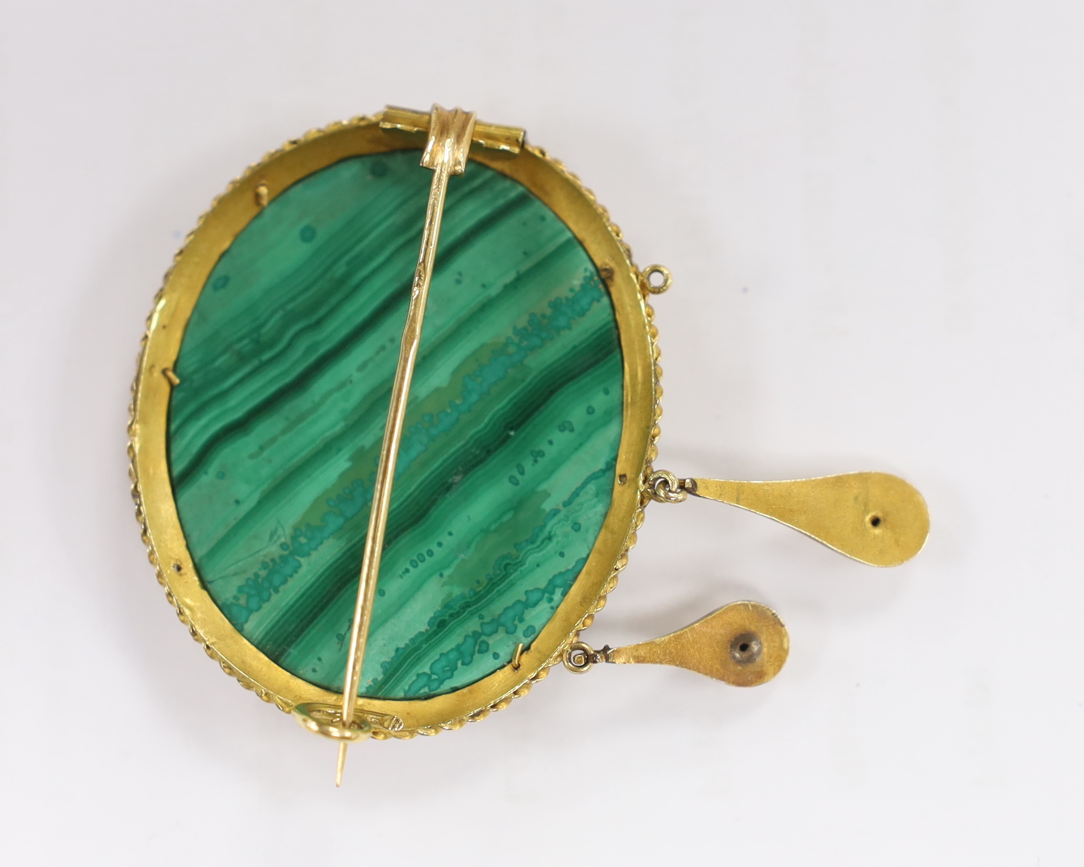 A Victorian yellow metal mounted malachite micro mosaic drop brooch, width 44mm, gross weight 21 grams, depicting St. Peters in Rome, (lacking drop).